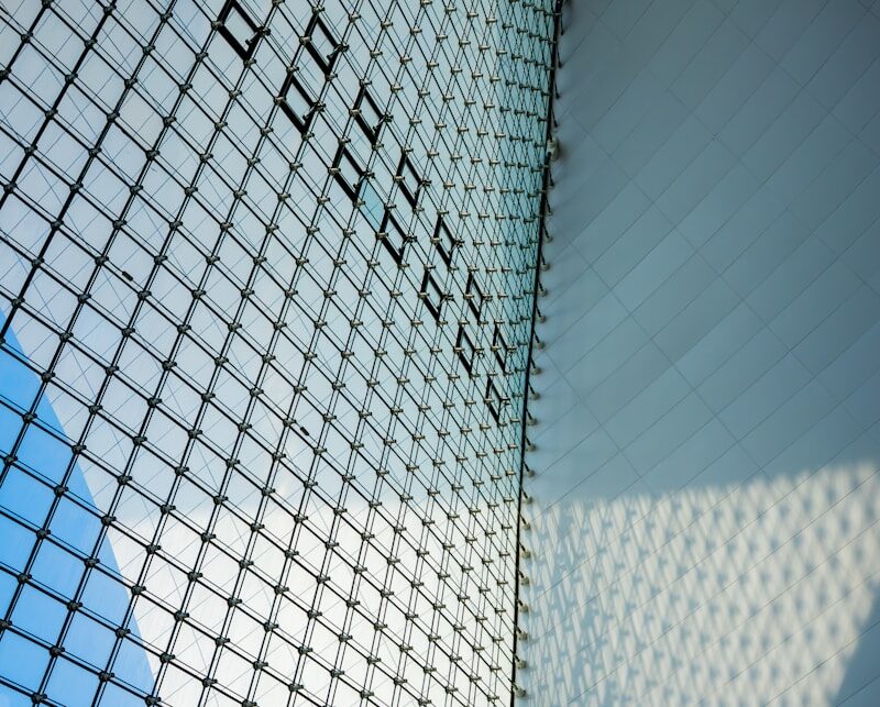 Modern glass building facade with geometric pattern